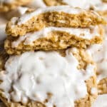 pile of sliced oatmeal cookies with one broken in half