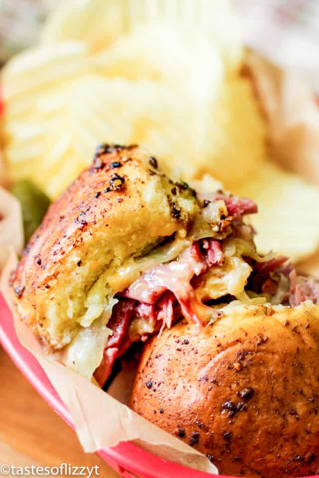 A close up of reuben sliders