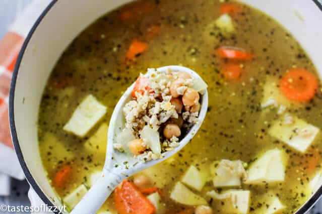 A bowl of soup, with Potato and Chicken