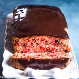 cherry quick bread with chocolate glaze on a plate