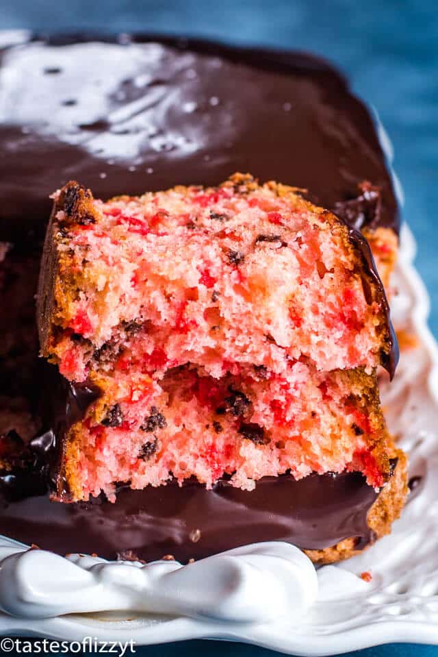 A close up of a piece of cherry cake on a plate