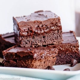 three brownies stacked on a plate