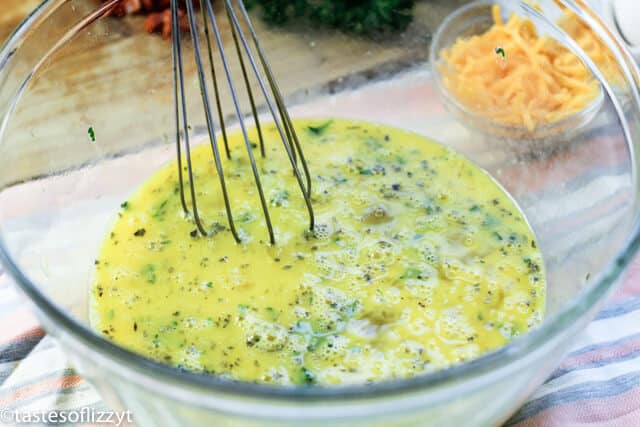 bowl of whisked eggs and seasonings