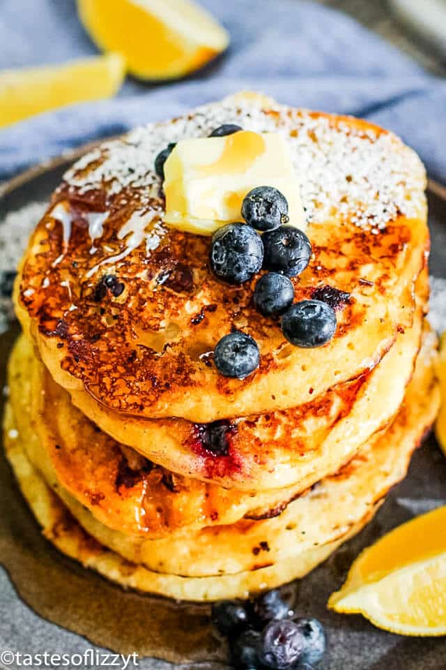 stack of blueberry cottage cheese pancakes topped with butter and syrup