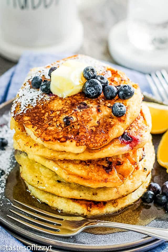 stack of cottage cheese pancakes with blueberries and syrup