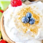 bowl of fruit dip with blueberry and strawberry