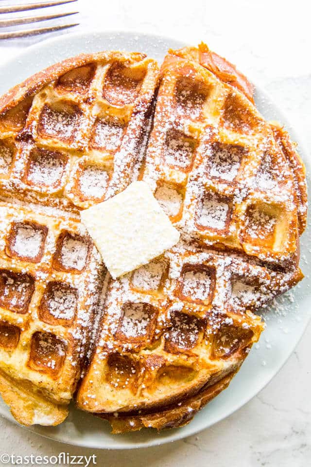 overhead shot of French Toast Waffles with powdered sugar on a plate