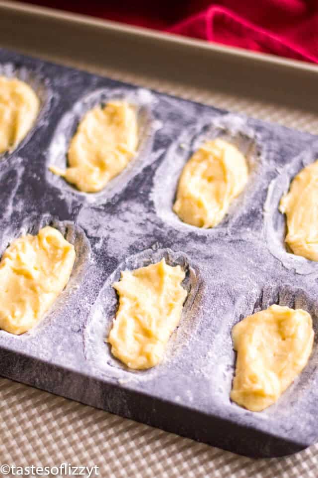 unbaked cookie dough in a madeleine pan