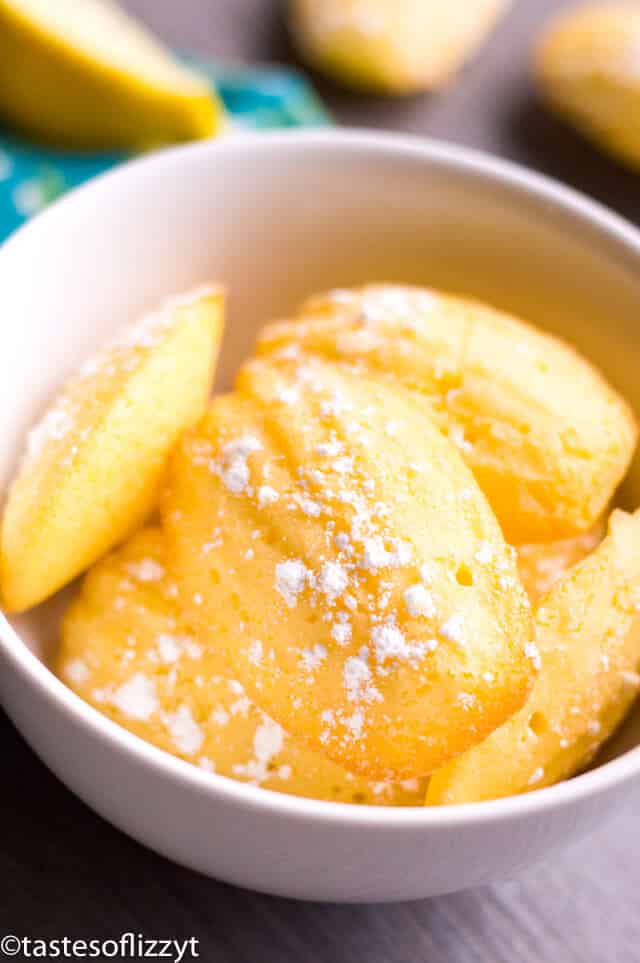 lemon madeleines dusted with powdered sugar