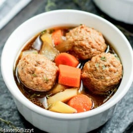 A bowl of soup, with Meatball and Potato