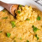 corn casserole with wooden spoon