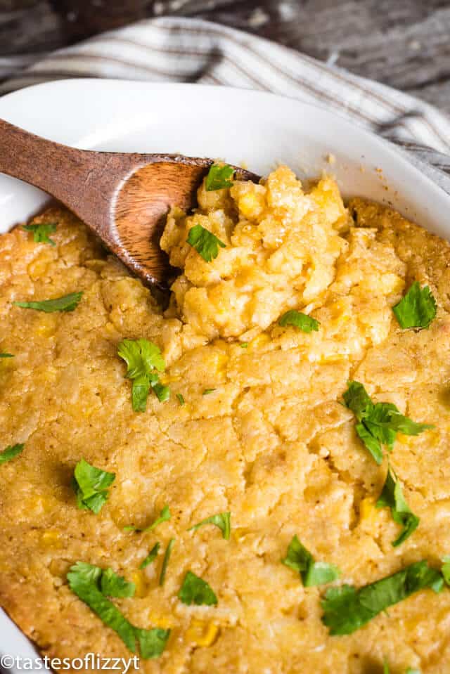 corn casserole with wooden spoon