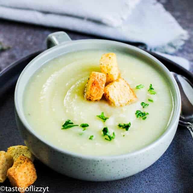 bowl of potato leek soup with croutons