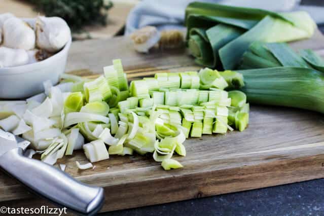 leeks shopped on a cutting board