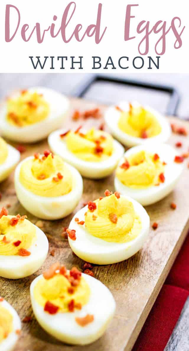 deviled eggs on wooden cutting board