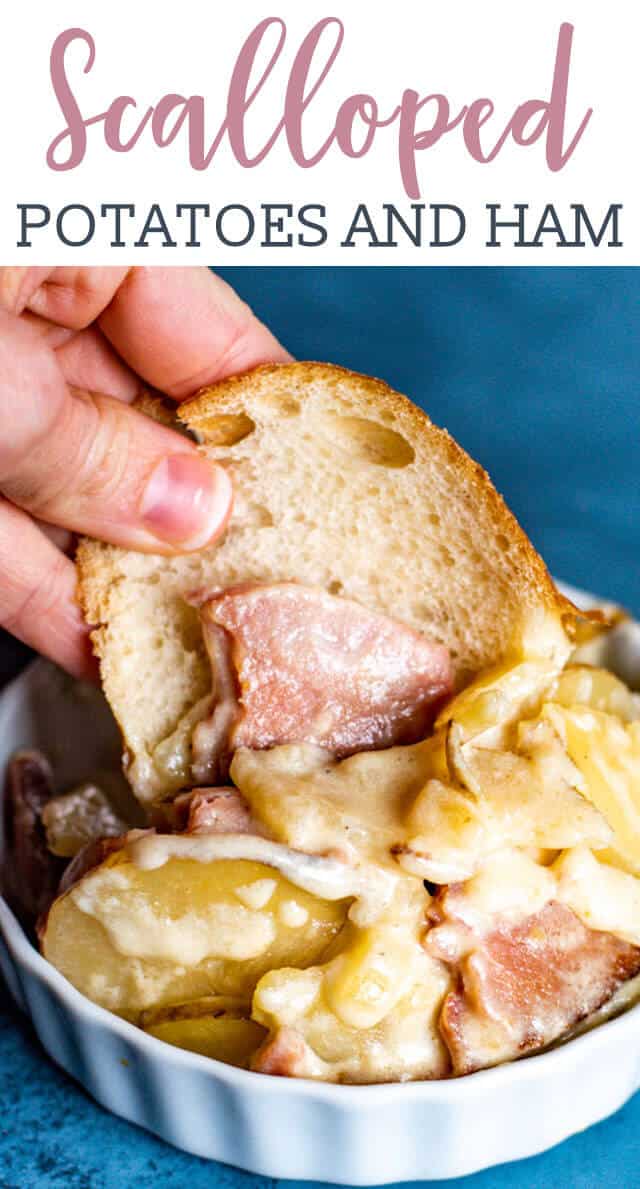 A close up of a person holding bread with ham and potatoes