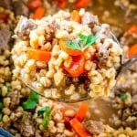 pot of beef barley soup with parsley