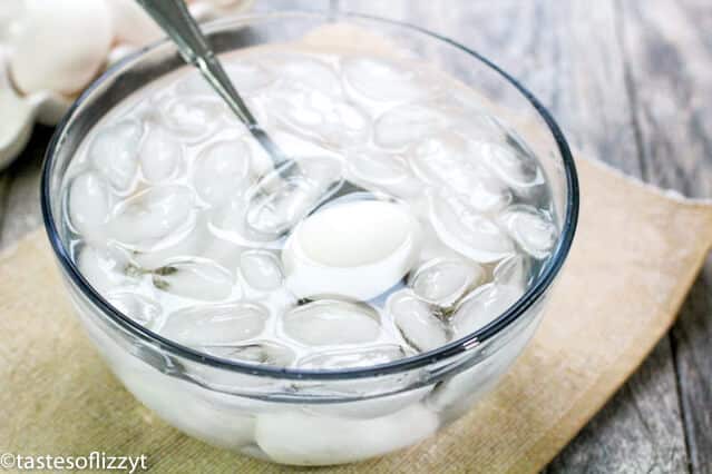 bowl of ice water with eggs in it
