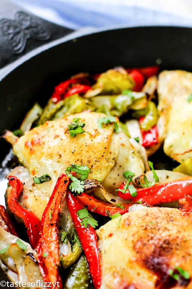 chicken thighs marinated in Italian dressing cooking in a skillet