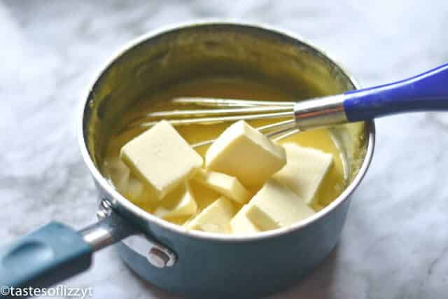 stirring ingredients to make a lemon curd recipe