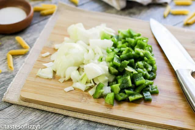 chopped onions and veggies on a cutting board