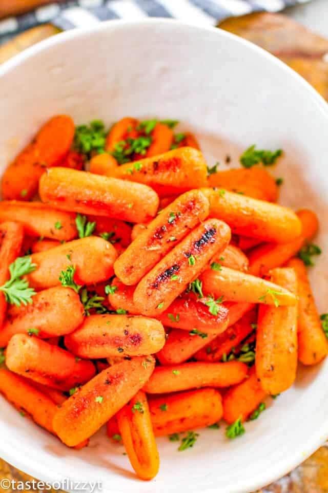 oven roasted baby carrots in a white bowl