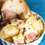 Scalloped Potatoes and Ham Recipe in bowl with bread