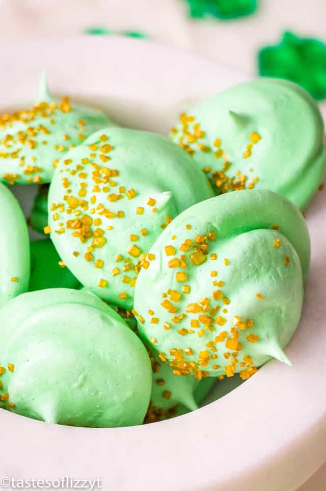 A close up of green meringue cookies