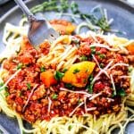 Three Meat Ragu Sauce Recipe on plate with fork