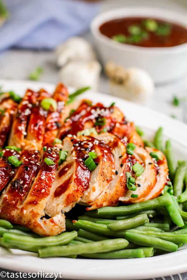 A plate of food with beans, with Chicken and Ginger sauce