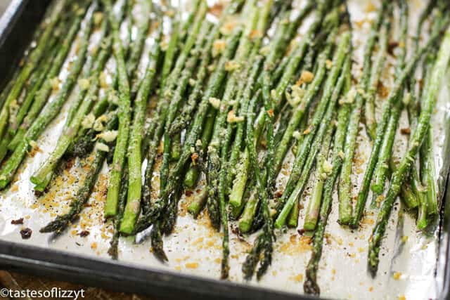 roasted asparagus on a baking sheet