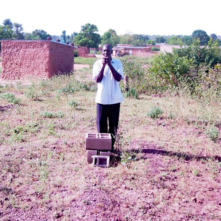 man standing by cement blocks
