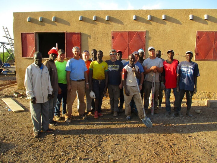 A group of people standing in front of a crowd