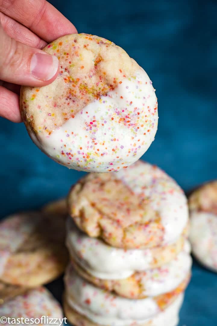 hand holding a white chocolate dipped cookie