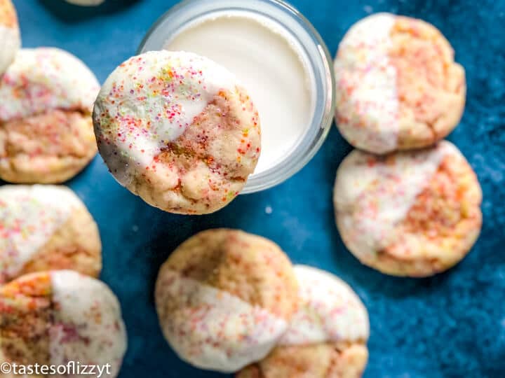 overhead view of sprinkle cookies and milk