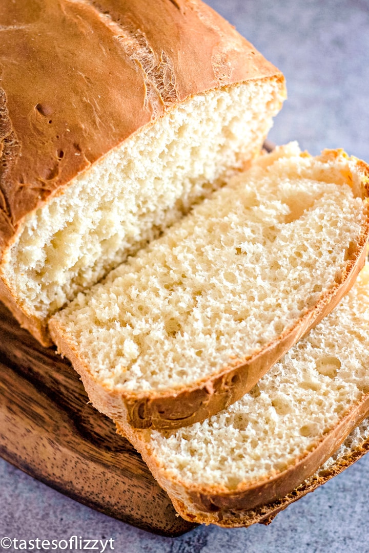 a loaf of bread cut with two slices