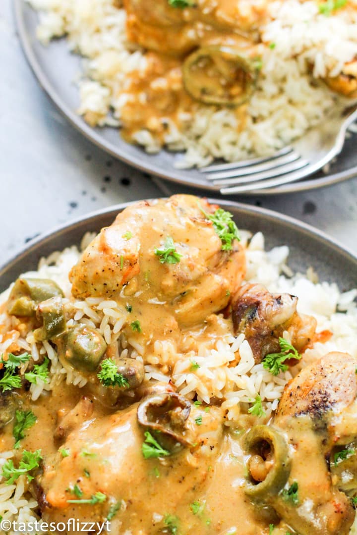 A plate of food with rice and jalapenos, Chicken