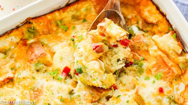 breakfast casserole with wooden spoon