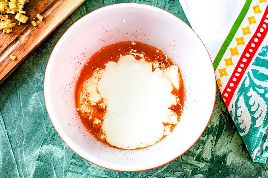 sauce for mexican street corn dip in a bowl