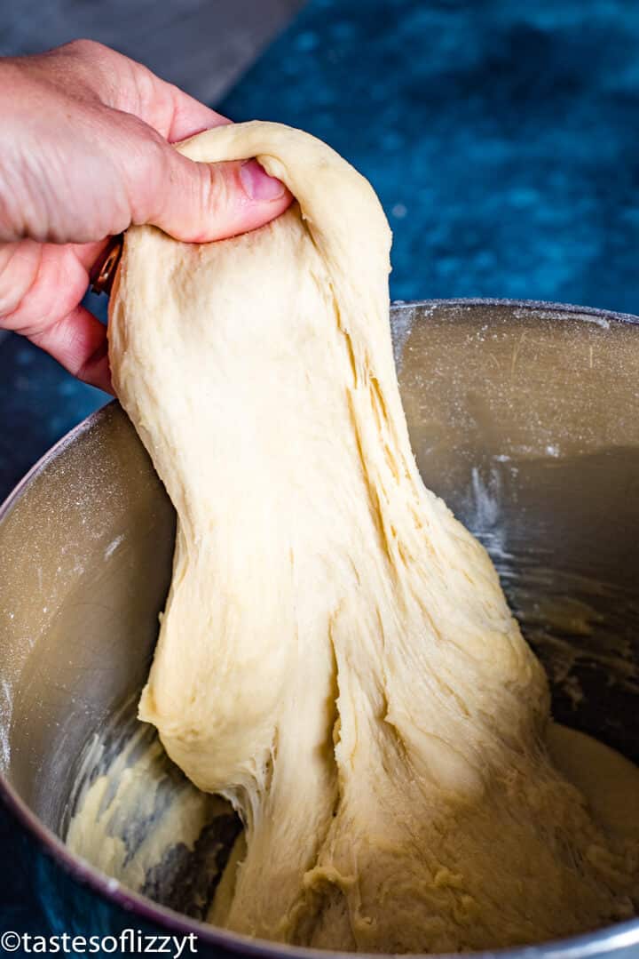 hand pulling soft dough