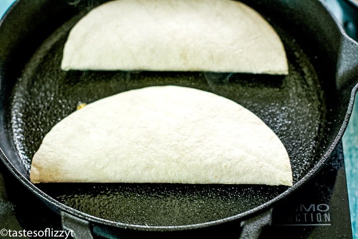 two quesadillas in a skillet