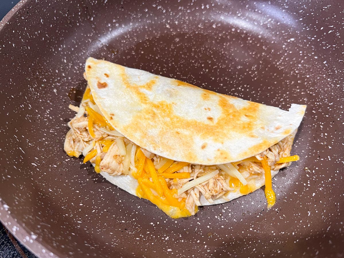 a quesadilla in a frying pan