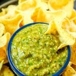 tortillas chips dipped in salsa verde