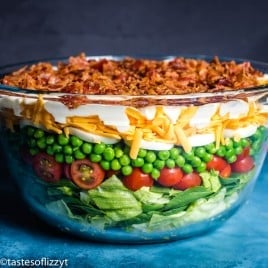 salad with 7 layers in glass bowl