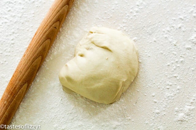 pizza dough on floured board