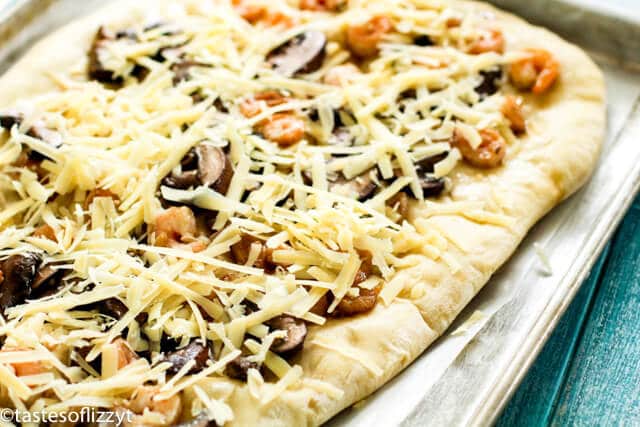 A pizza covered in cheese and toppings