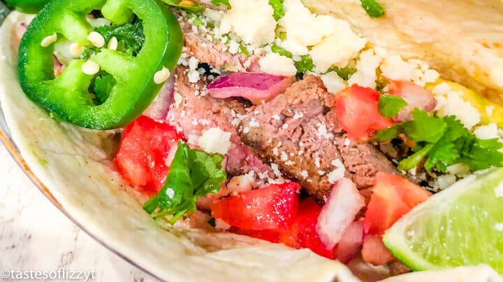 A close up of a steak taco