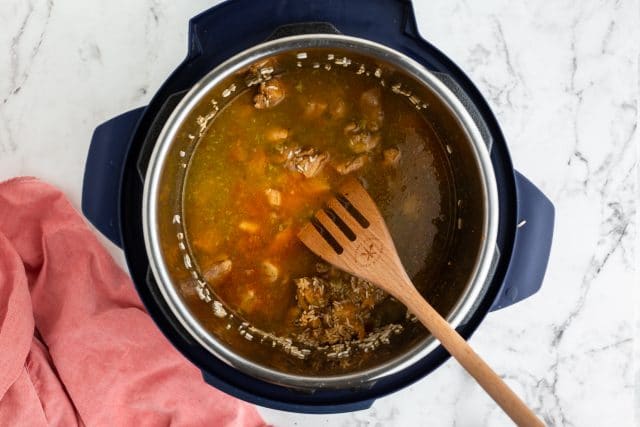 chicken, rice and broth in an instant pot