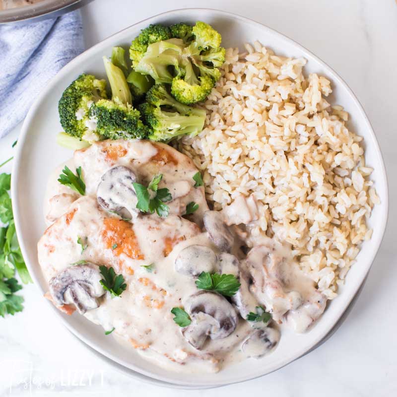 A plate of food with rice and chicken marsala