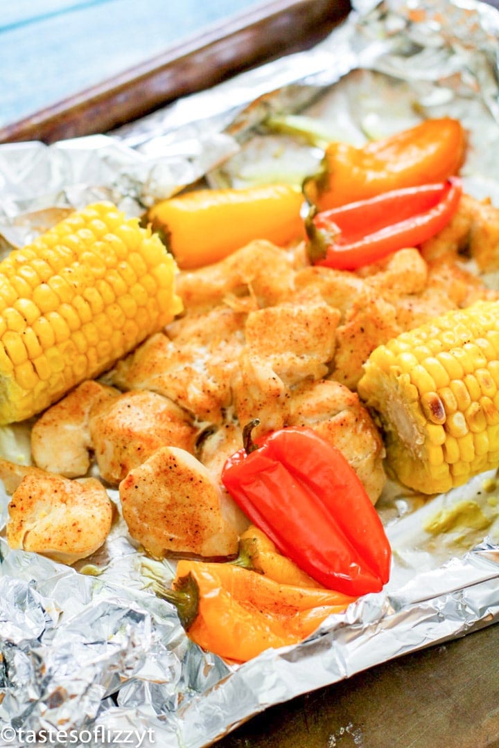 chicken, peppers and corn on foil